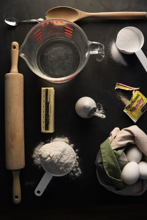 Baking ingredients and tools arranged on a work surface